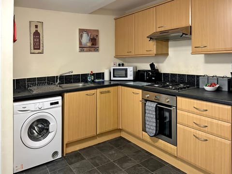 microwave, oven, stove, washing machine, kitchen