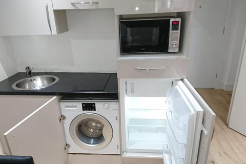 Kitchen or kitchenette, washing machine