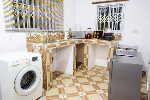 Kitchen or kitchenette, oven, stove, washing machine