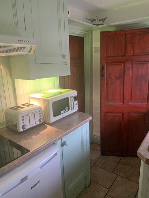 Kitchen or kitchenette, stove, toaster