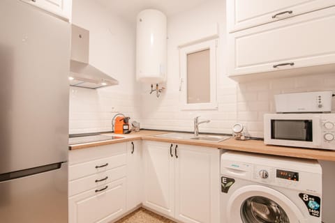 Kitchen or kitchenette, washing machine