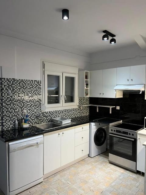 Kitchen or kitchenette, dishwasher, oven, stove, washing machine