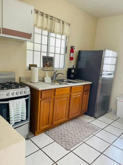 Kitchen or kitchenette, dishwasher, oven, stove