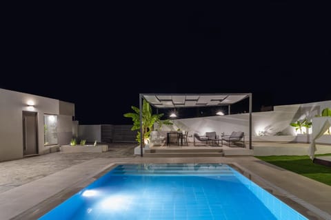 Patio, Night, Pool view, Swimming pool, sunbed