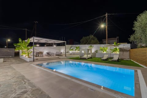 Property building, Night, Pool view, Swimming pool, sunbed