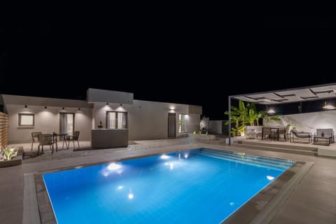 Property building, Patio, Night, Pool view, Swimming pool, sunbed