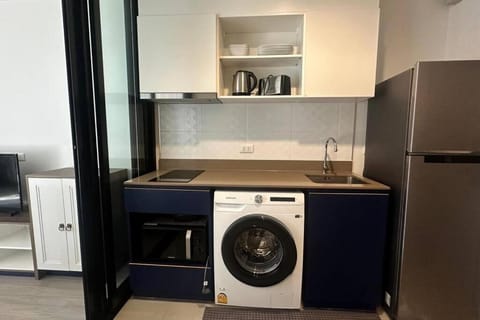 Kitchen or kitchenette, washing machine