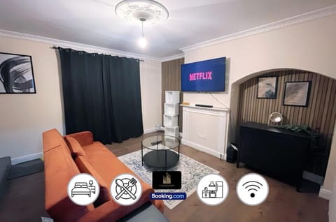 TV and multimedia, Living room, Photo of the whole room, Seating area, Text overlay