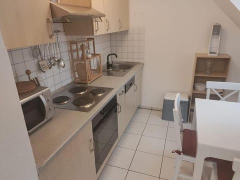 Kitchen or kitchenette, dishwasher, microwave, stove