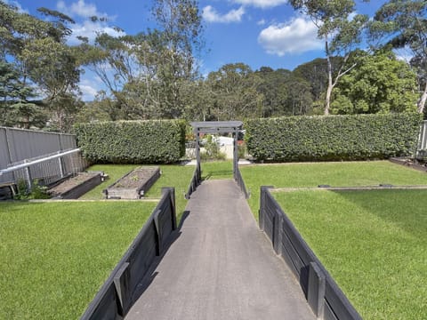 4-Bed Coastal Escape with Water & Garden Views House in Batemans Bay