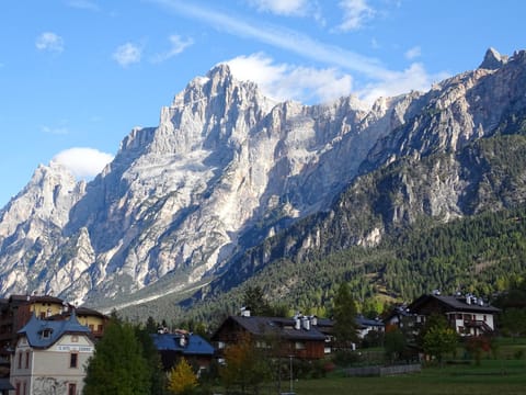 Property building, Nearby landmark, Natural landscape, Mountain view