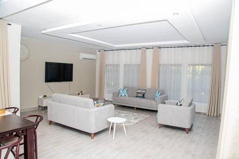 Communal lounge/ TV room, Living room, Seating area, air conditioner