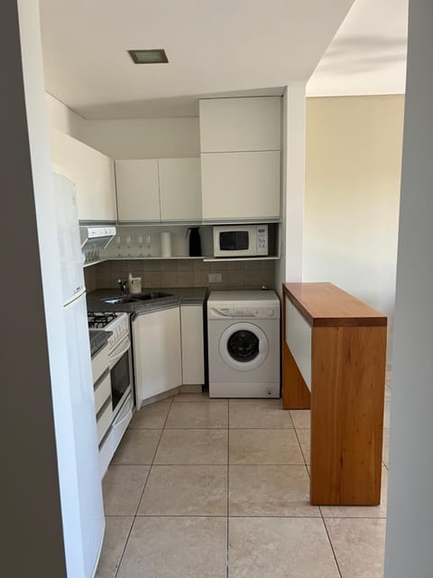 Kitchen or kitchenette, oven, washing machine