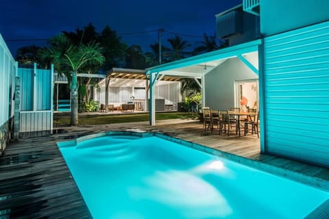 Property building, Patio, Night, Pool view, Swimming pool, sunbed