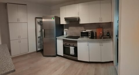 Kitchen or kitchenette, oven, stove, toaster