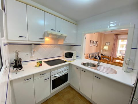 Kitchen or kitchenette, microwave, oven, stove