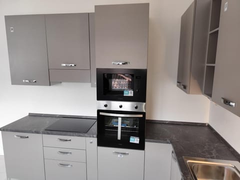 Kitchen or kitchenette, microwave, oven, stove