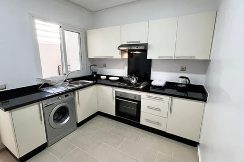 Kitchen or kitchenette, dishwasher, oven, toaster, washing machine, dryer