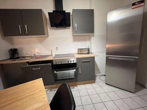 Kitchen or kitchenette, dishwasher, oven, stove