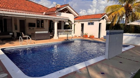 Property building, Patio, Day, Pool view, Swimming pool