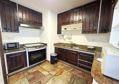 Kitchen or kitchenette, microwave, stove, kitchen