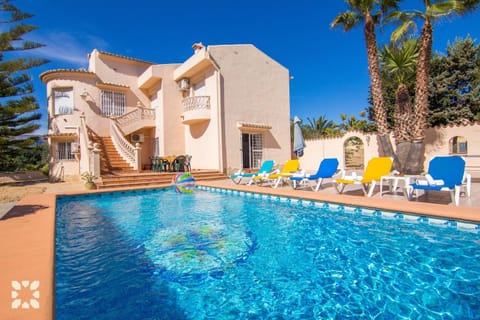 Property building, Patio, Communal lounge/ TV room, Day, Living room, Seating area, Pool view, Swimming pool, sunbed