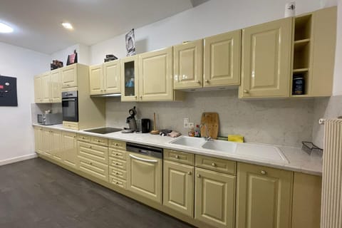 Kitchen or kitchenette, dishwasher, oven, stove