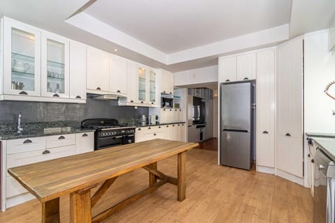 Kitchen or kitchenette, dishwasher, oven, stove