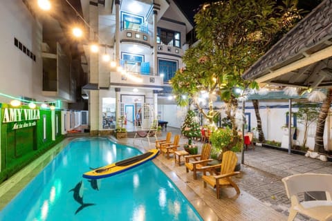 Property building, Patio, Night, Pool view, Swimming pool, sunbed