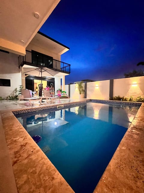 Patio, Night, Pool view, Swimming pool, sunbed