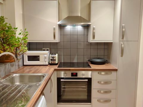 Kitchen or kitchenette, stove, toaster