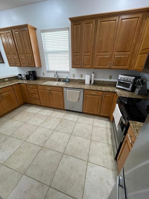 Kitchen or kitchenette, dishwasher, oven, stove, toaster