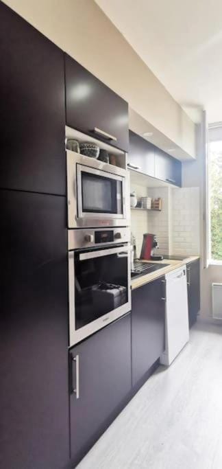 Kitchen or kitchenette, dishwasher, oven, stove, toaster