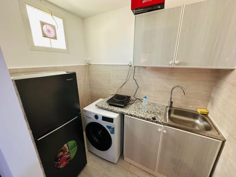 Kitchen or kitchenette, washing machine