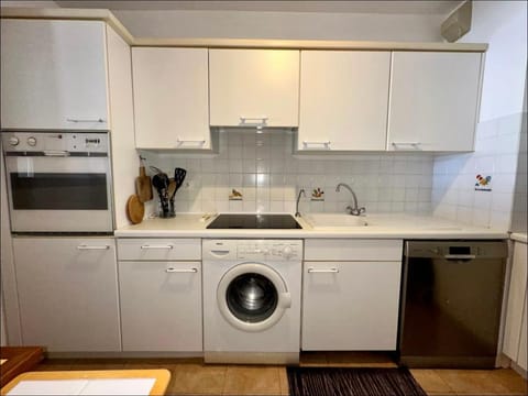 Kitchen or kitchenette, dishwasher, oven, stove, washing machine