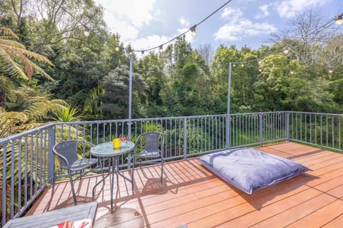 Unwind in Style- Deck with Lush Green Backdrop House in Hamilton