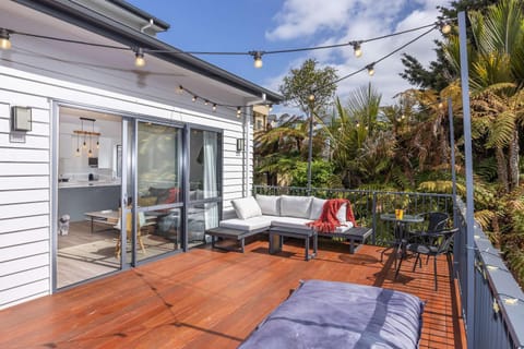 Unwind in Style- Deck with Lush Green Backdrop House in Hamilton