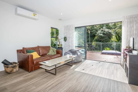 Unwind in Style- Deck with Lush Green Backdrop House in Hamilton