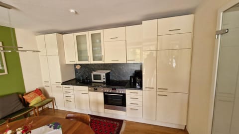 Kitchen or kitchenette, dishwasher, oven, stove, toaster