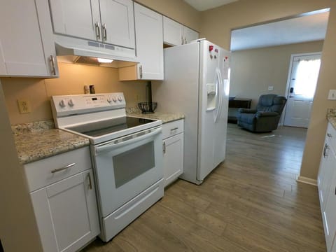 Kitchen or kitchenette, Living room, Seating area, oven, stove