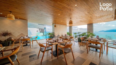 Restaurant/places to eat, Natural landscape, Seating area, Sea view, Swimming pool