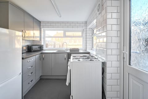 Kitchen or kitchenette, microwave, stove, kitchen