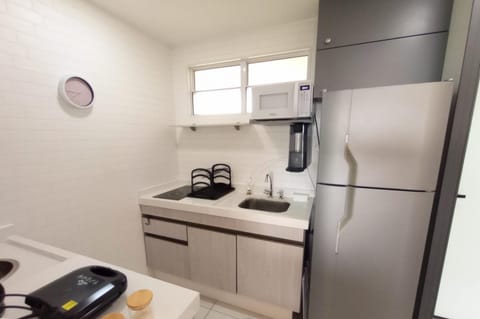 Kitchen or kitchenette, microwave, stove