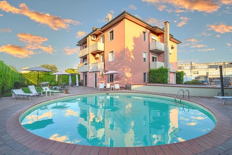Property building, Day, Natural landscape, Pool view, Swimming pool, sunbed