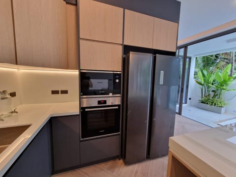 Kitchen or kitchenette, dishwasher, oven, stove