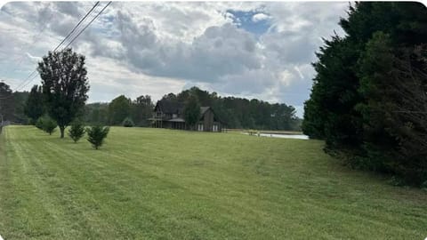 Log Castle and a spring-fed lake House in Carrollton