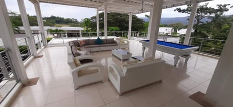 Living room, Seating area, Pool view