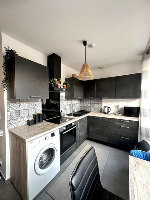 Kitchen or kitchenette, dishwasher, oven, stove, washing machine