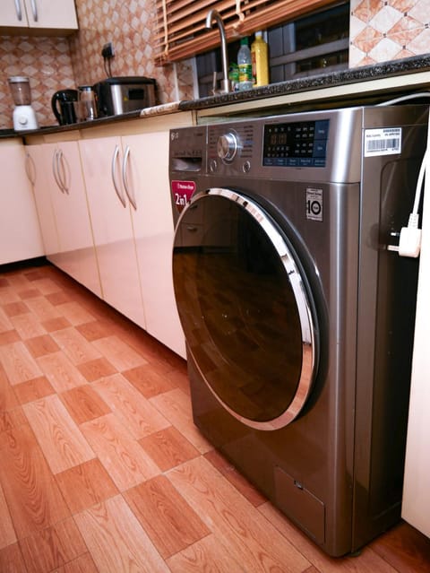 Kitchen or kitchenette, washing machine