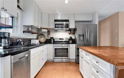 Kitchen or kitchenette, dishwasher, oven, stove